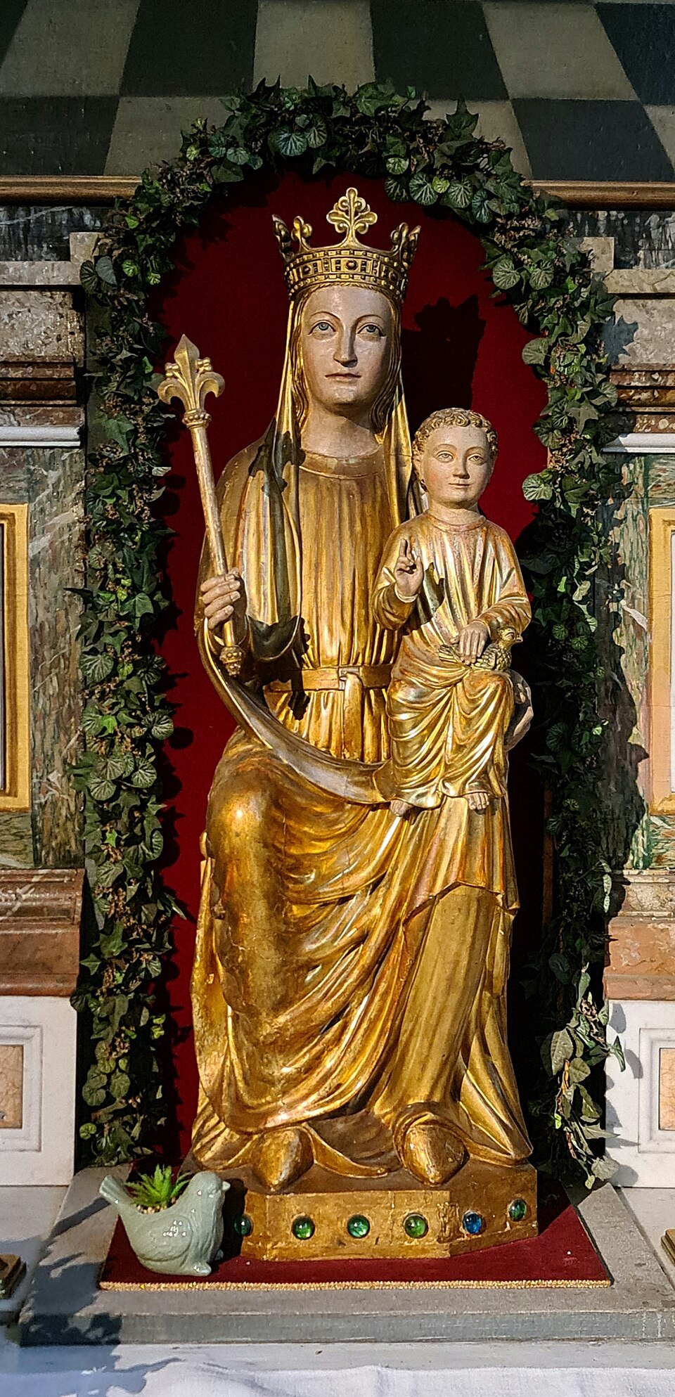 A gilded statue of the Madonna and Child in the church