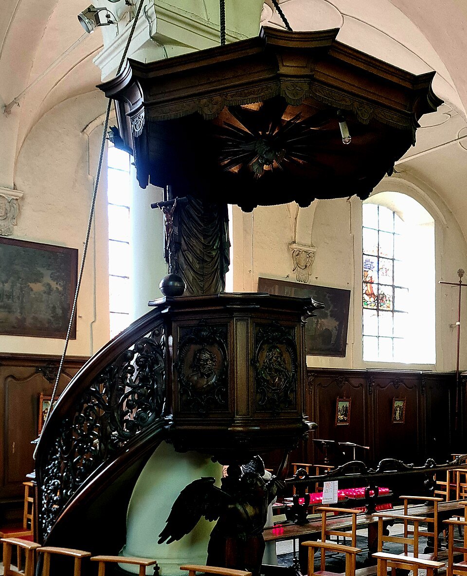 The carved wooden pulpit in the Beguinage church
