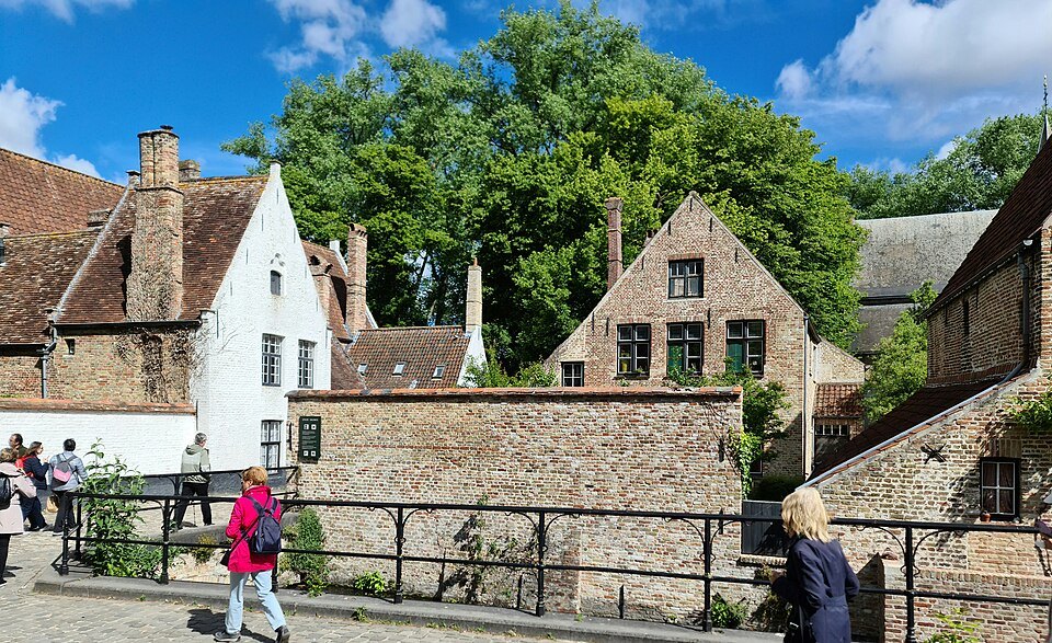Visitors on the bridge outside the Beguinage walls
