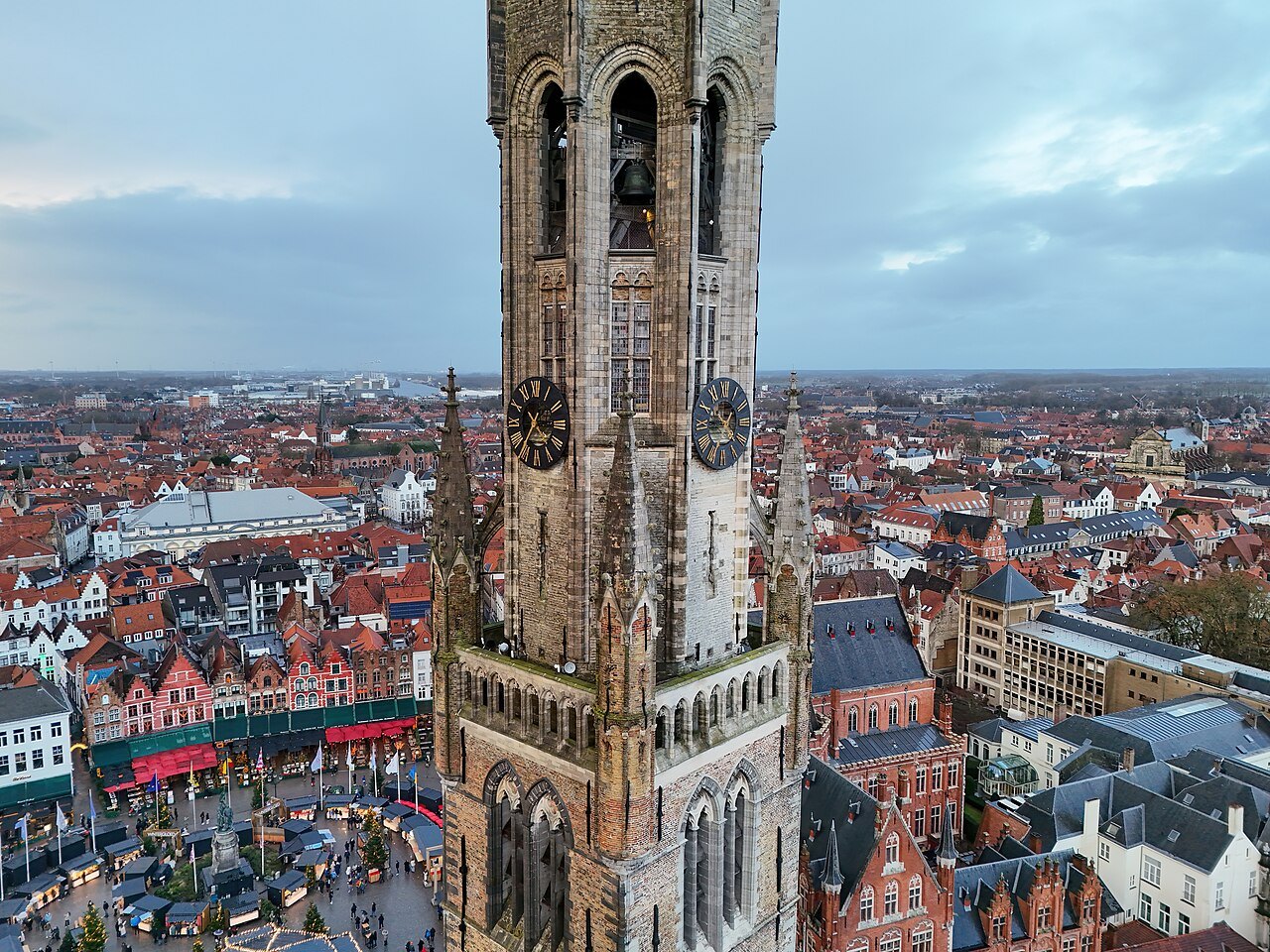 The Belfry's clock stage and octagonal top, the roofs of the Markt spread out below