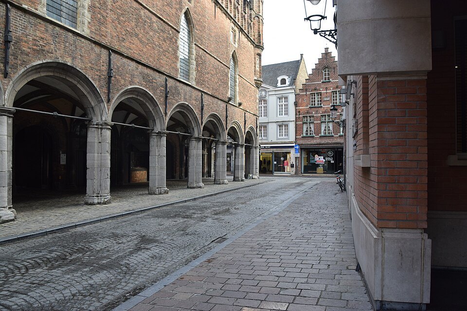 The stone arcade running along the side of the halls