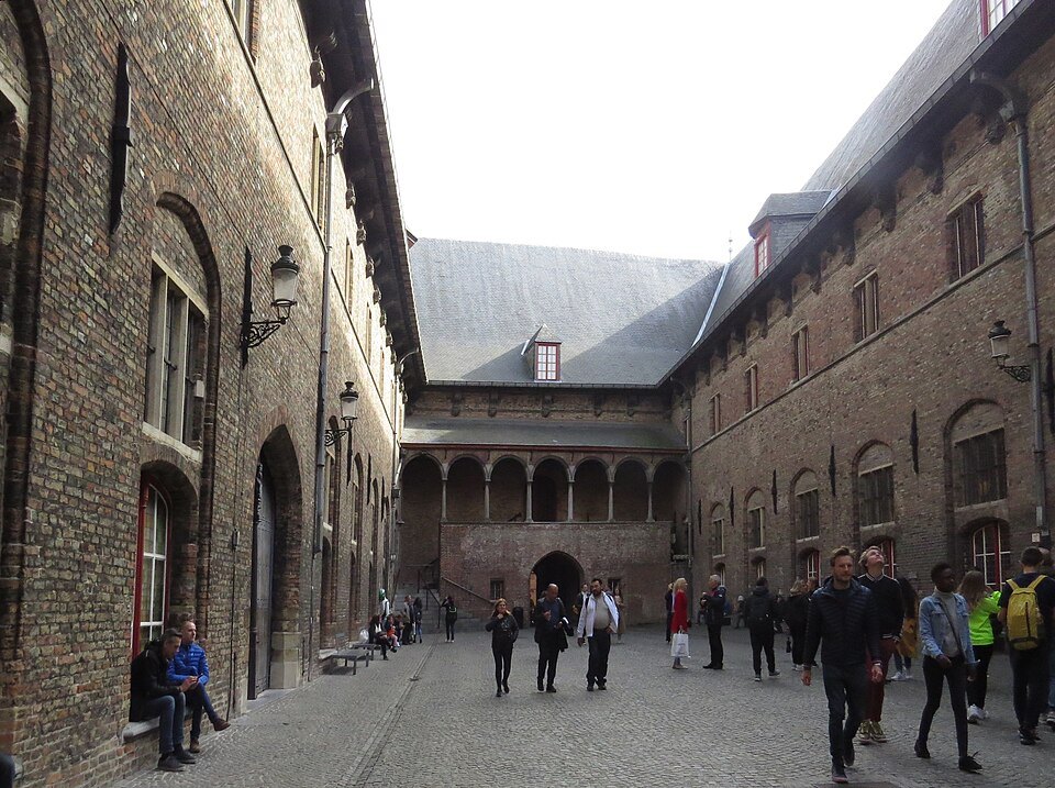 Visitors crossing the halls' courtyard towards the tower entrance