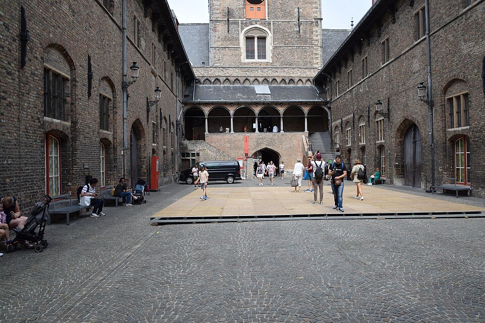 The arcaded courtyard of the market halls, with the tower rising behind