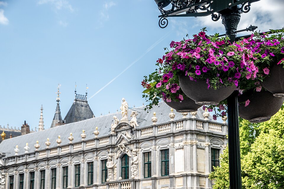 The baroque Provost's House behind a hanging basket of flowers
