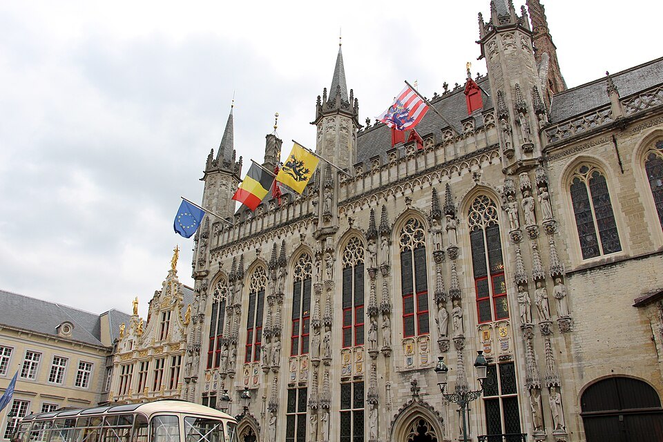 Flags above the doorway of the City Hall's Gothic front