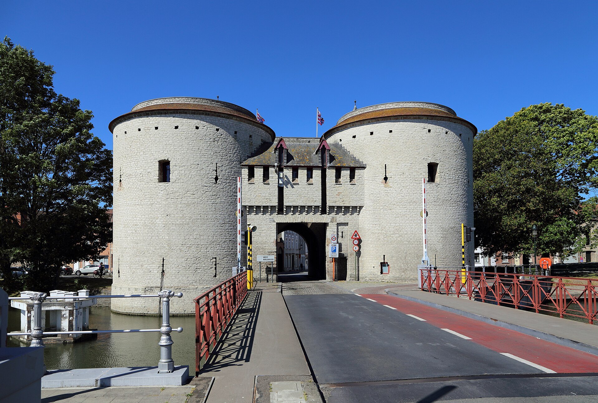 The Kruispoort's two round stone towers, seen along the bridge over the outer canal