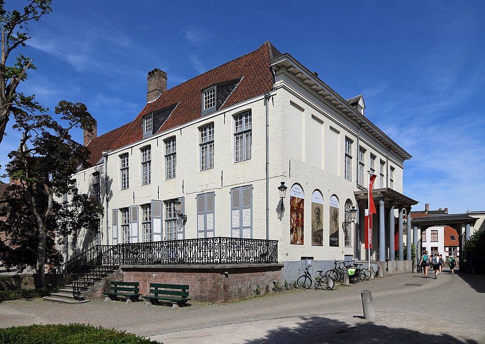 The white eighteenth-century Arentshuis beside its garden
