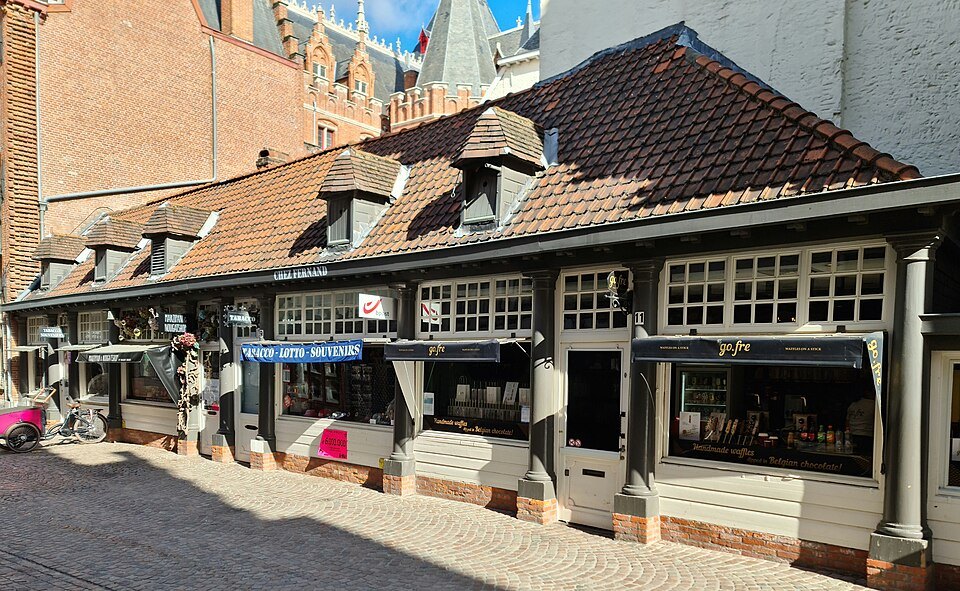 Low arcaded shops along Breidelstraat