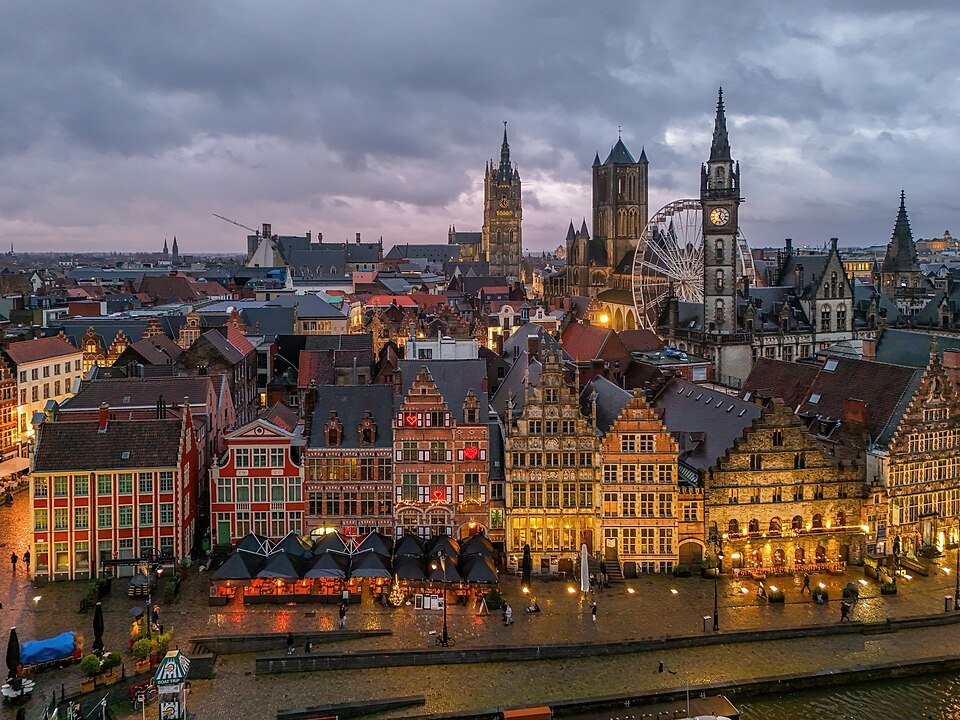 The towers of Ghent above the Graslei at dusk