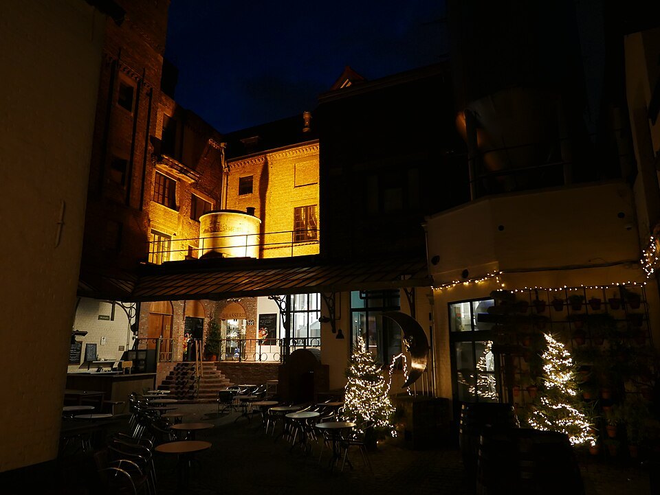 The De Halve Maan brewery lit up at night