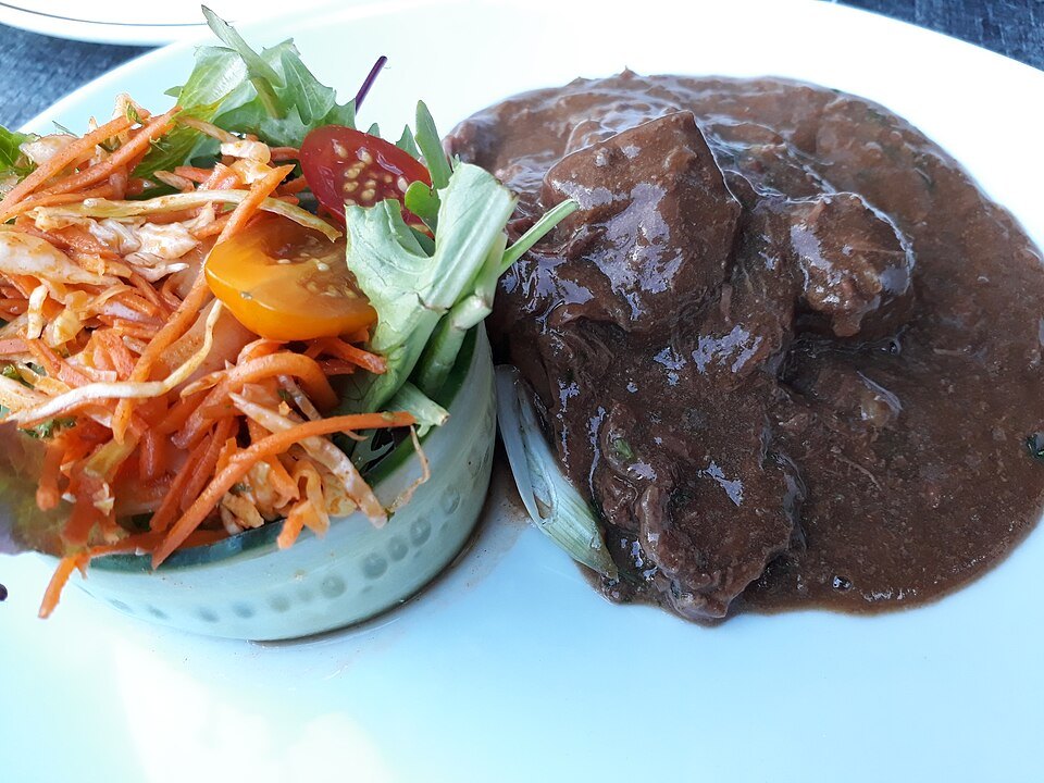 Flemish stew served with a side salad