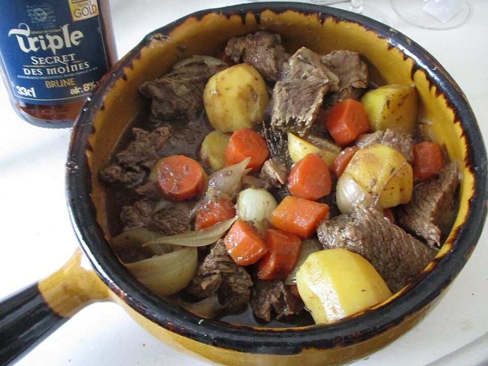 Carbonade flamande with vegetables in a pan