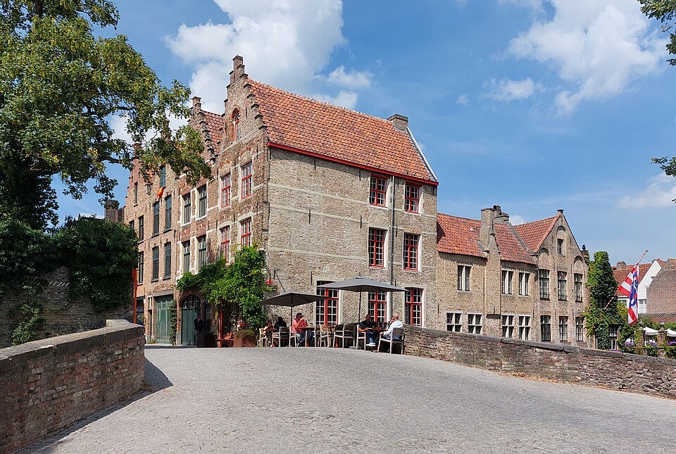 The Meebrug leading to a stepped-gabled house with a café terrace