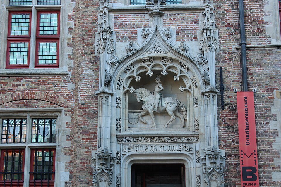 A carved relief of a horseman above a doorway in the courtyard