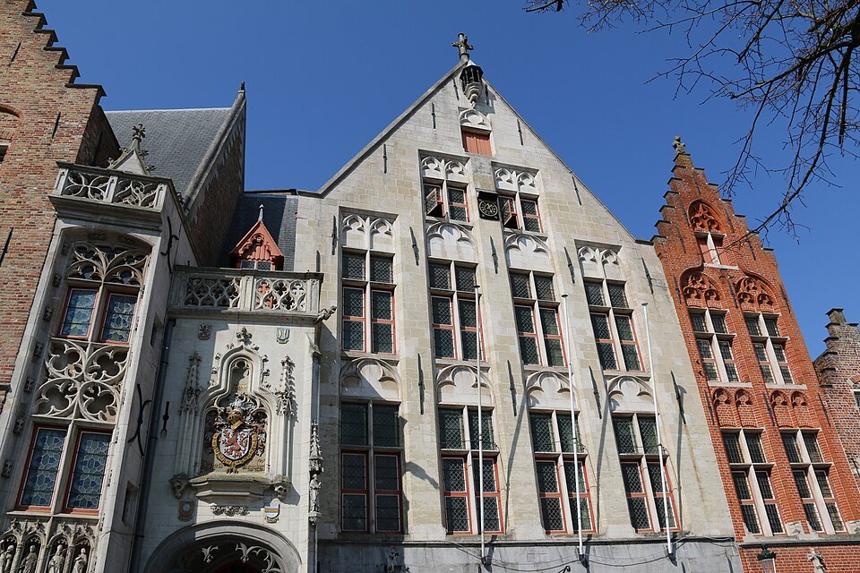 Richly carved late Gothic stonework on a gable at the square
