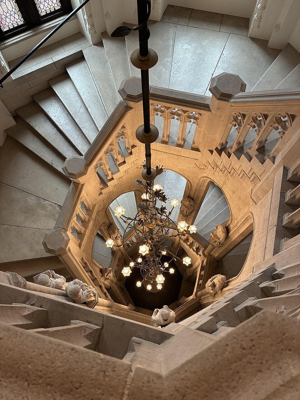A spiral staircase inside the Provincial Court, seen from below