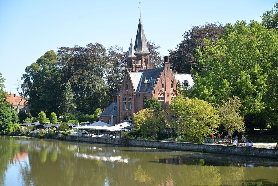 Kasteel de la Faille across the lake, a terrace below the trees