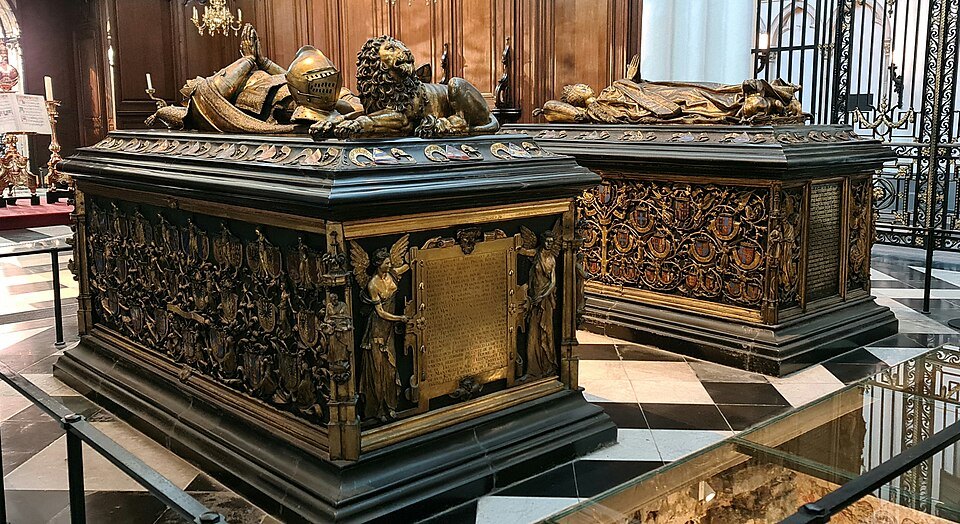 The two Burgundian tombs side by side, gilded effigies on dark chests