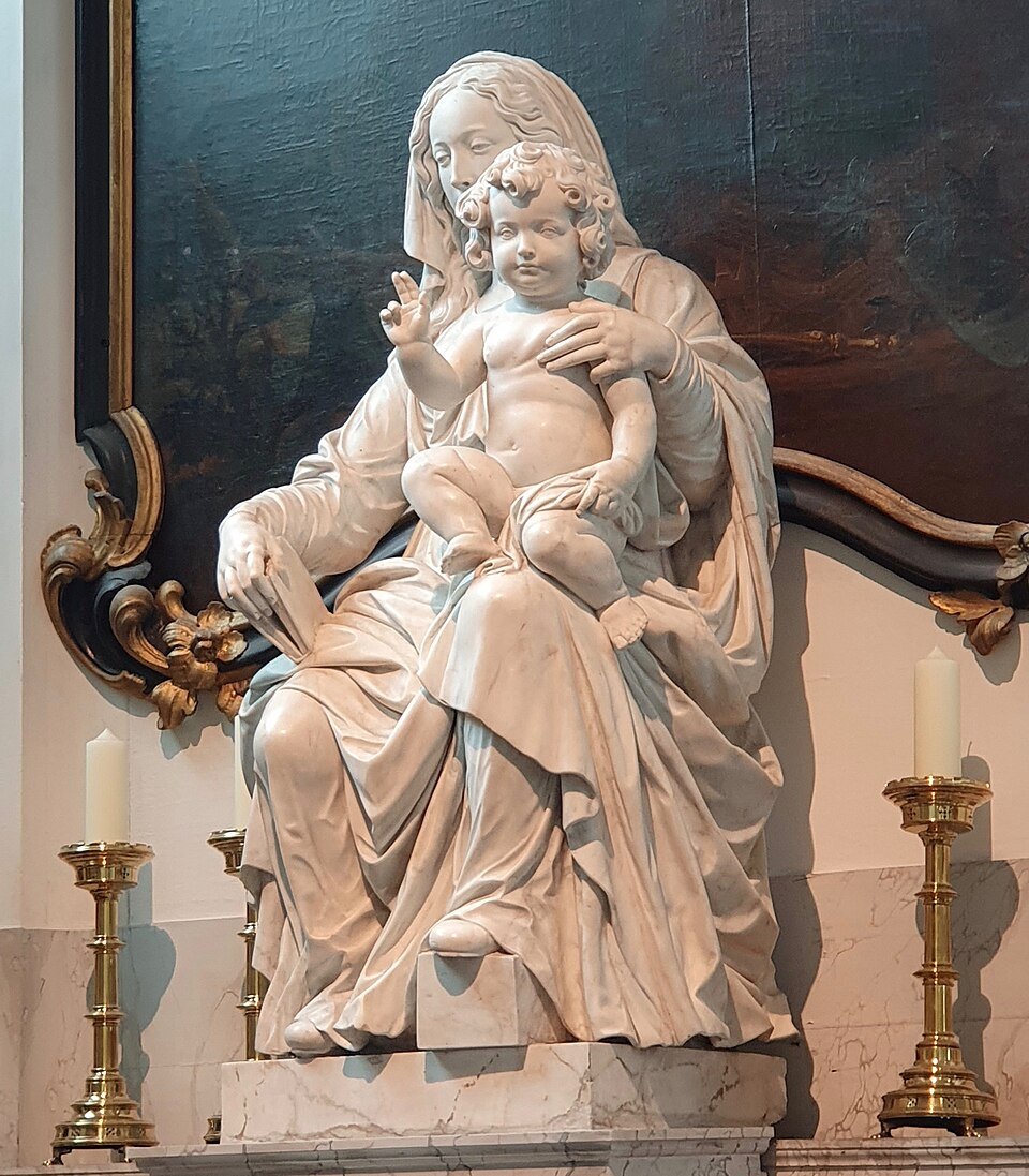 Michelangelo's white marble Madonna and Child in its dark altar