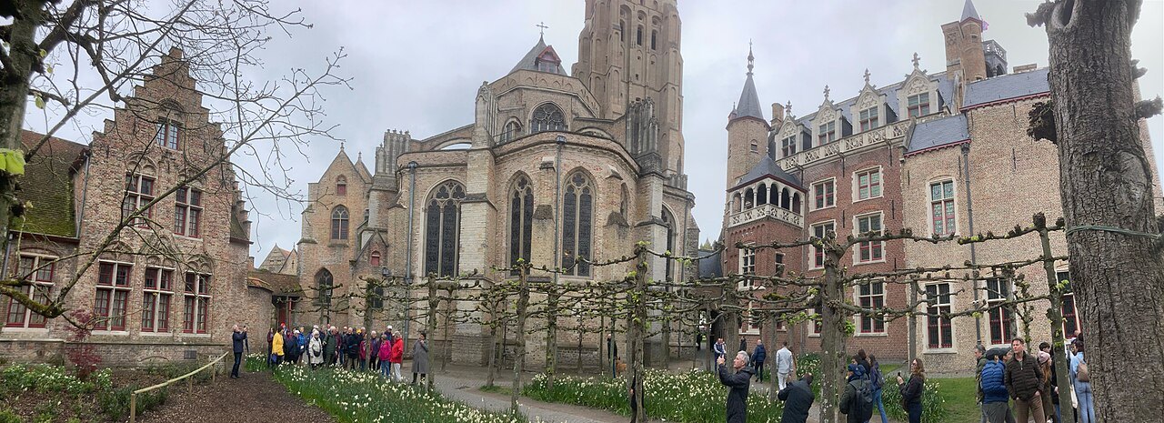 The apse and brick tower of the Church of Our Lady above the garden beside it