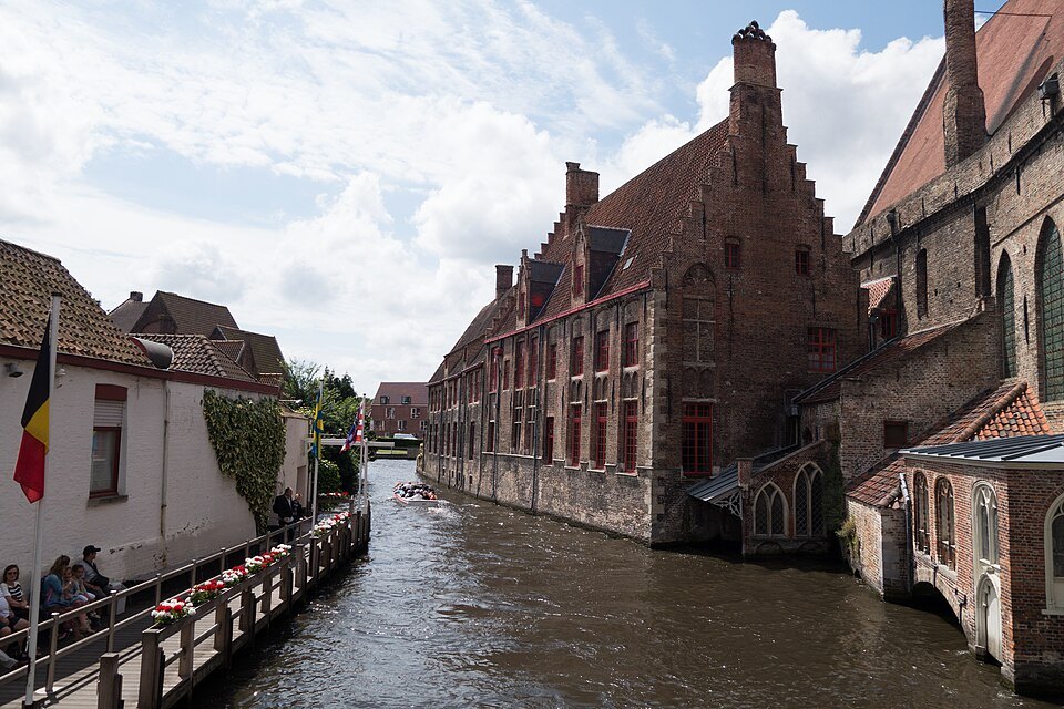 The brick wards of St. John's Hospital rising from the canal