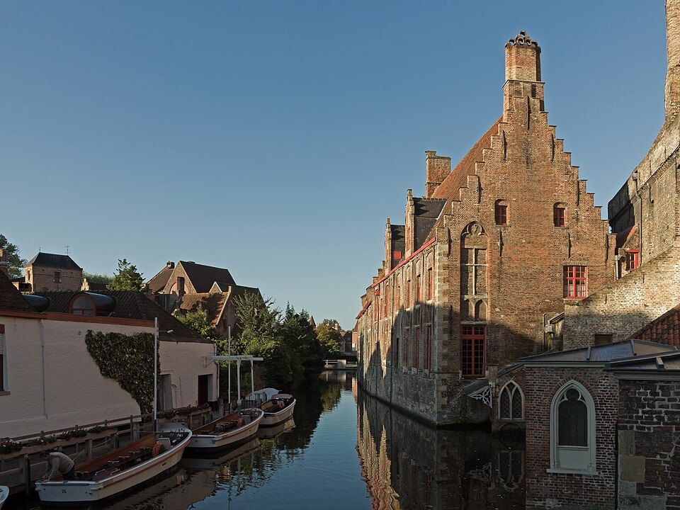 Boats tied up on the canal below the hospital's gable