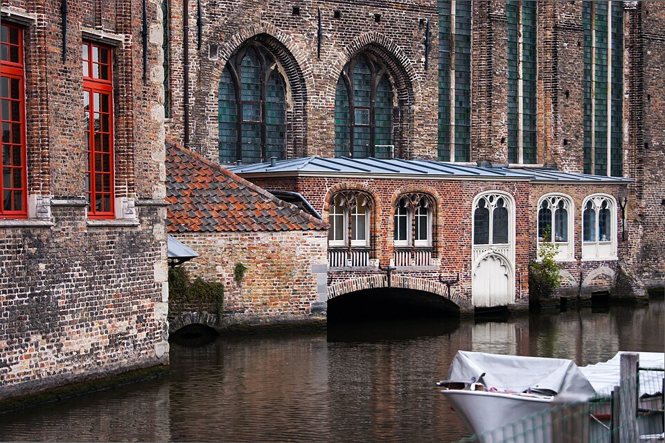 Small arched rooms built out over the canal against the walls of St. John's Hospital