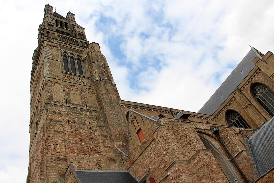 The brick tower and the body of the cathedral seen from below