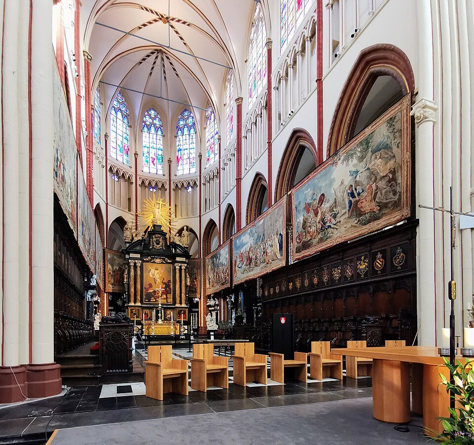 Tapestries hanging above the choir stalls, the high altar beyond