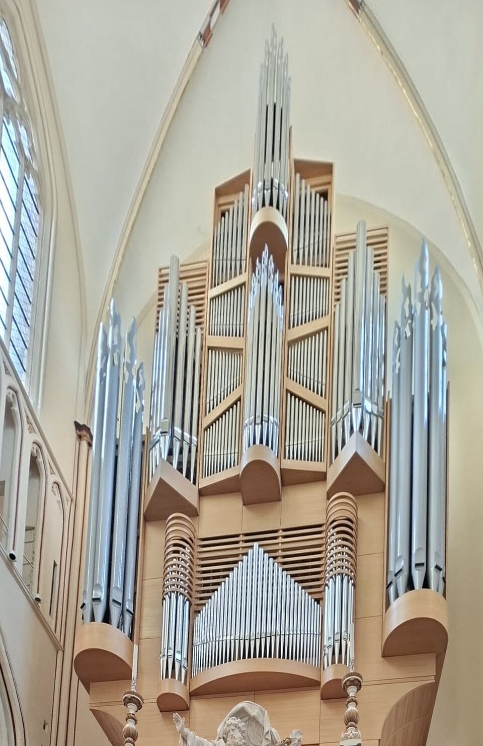 The pipes of the cathedral organ rising towards the vault