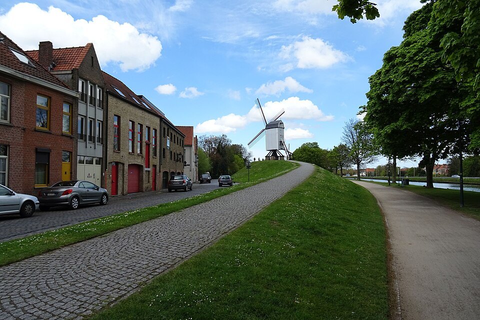 The rampart road and grassy bank, a mill standing at the end